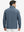 Back upper body view of the misty blue mock neck golf pullover, model turns head for relaxed pose.