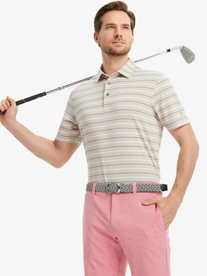 Model in LIGHT KHAKI STRIPE Golf Polo holding club — dynamic front half-body pose