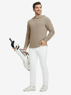 Model holding a golf bag, wearing light brown heather texture solid hoodies pullover in full-body view.