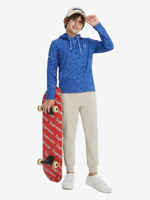 Model holding a skateboard, wearing blue molecular structure youth full print stylish hoodies pullover in full-body view.