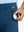 Golf ball sliding into pocket of Quick Dry Casual Shorts in Blue Indigo, practical sports detail.