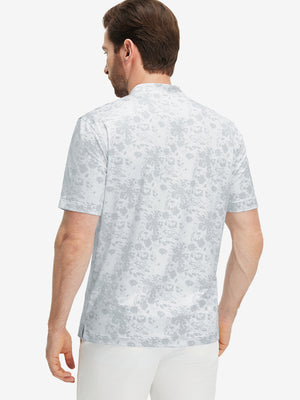 Back half-body of model in grey splatter stretch printed collarless henley golf shirts