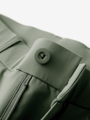 Waist detail of quick dry casual dress pants in olive green, featuring button and zipper design.