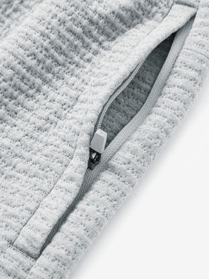 Detail of zipper pocket on soft sweatpants with 4 zipper pockets in light grey heather