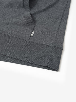 Hem detail of the Black Grey Heather Athletic Golf Hoodie, highlighting clean stitching and neat design.