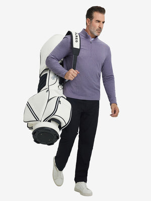 Texture heather fleece lined 1/4 zip pullover, model in purple carrying a golf bag full body view