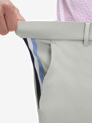 Detail view of elastic waistband on silver gray breathable casual slacks with 4 pockets