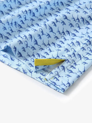 Hem slit detail of MAELREG Performance Jersey Print Polo in Blue Dinosaur – comfort & movement
