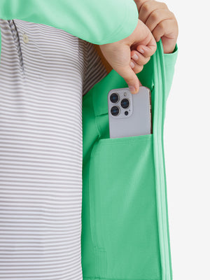 Close-up of the front side pocket detail on kids soft lightweight fleece lined jacket in turquoise, showing quality stitching.