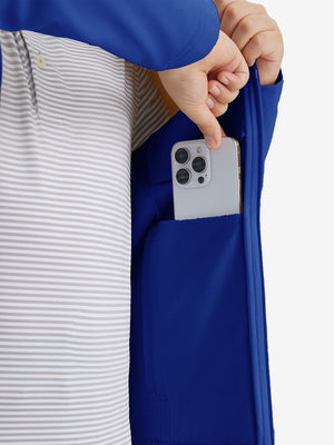 Close-up of the front side pocket detail on kids soft lightweight fleece lined jacket in klein blue, showing quality stitching.