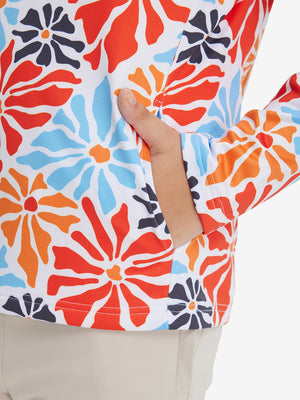 Model with both hands in pockets wearing youth full print stylish hoodies pullover in colorful flower.
