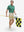 Full-body front view of model wearing the golf vacation 4 way stretch print collared polo shirt, showing the complete outfit