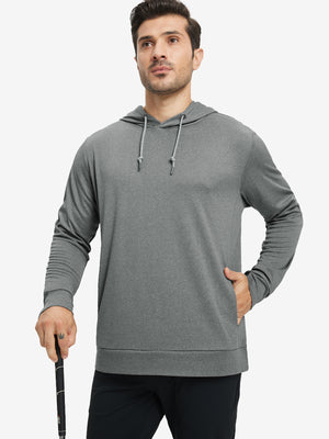 Model with one hand in pocket, wearing classic heather pullover hoodie in grey melange, relaxed look.
