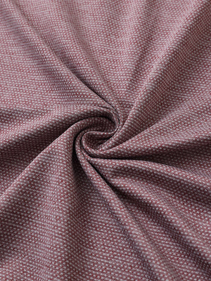 Close-up of dusty rose heather ventilated heather jacquard polo fabric showing breathable texture and subtle pattern details.