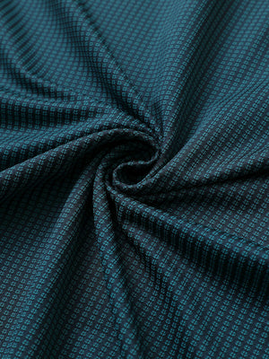 Close-up of turquoise elegant performance jacquard polo fabric showing refined texture and subtle pattern.