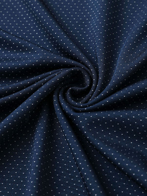 Close-up of navy 4 way stretch jacquard polo fabric texture highlighting intricate woven pattern and elasticity.