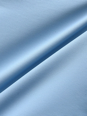Close-up of light blue water resistant golf shorts fabric texture.