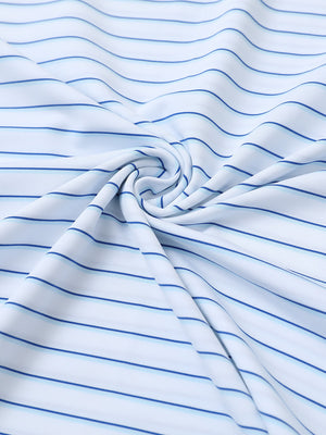 Close-up of white/light blue stripe popular yarn dyed stripe polo fabric showing crisp lines and soft texture.