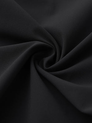 Close-up of quick dry casual dress pants fabric in black, smooth texture with breathable finish