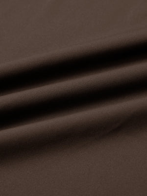 Close-up fabric detail of lightweight golf quarter zip pullover, smooth texture and breathable feel in coffee brown