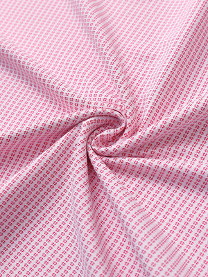 Close-up of rose elegant performance jacquard polo fabric showing refined texture and subtle pattern.