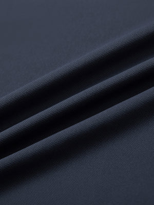 Close-up of dark grey long sleeve solid jersey polo fabric texture showing soft knit and smooth finish details.