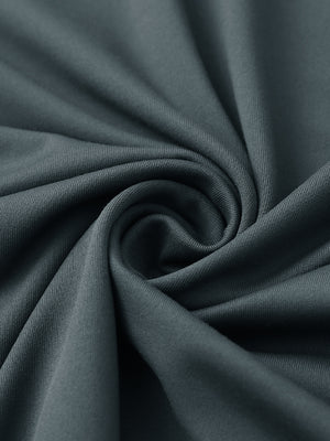 Close-up of fabric on stylish chest print snap polo, showing texture and finish in dark grey.