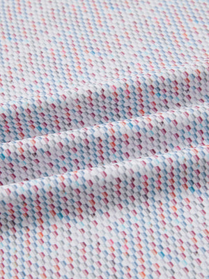 Close-up of colorful hexagon full print lightweight quarter zip pullover fabric, soft and breathable texture