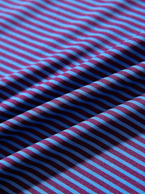 Fabric detail of Performance cooling polo - youth with breathable feel in plum blue stripe