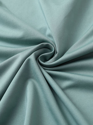 Close-up of beryl green chest print polo shirt fabric showing smooth texture and crisp graphic application area.