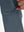 Detail view of design on grey blue flat front golf joggers pants with belt loops