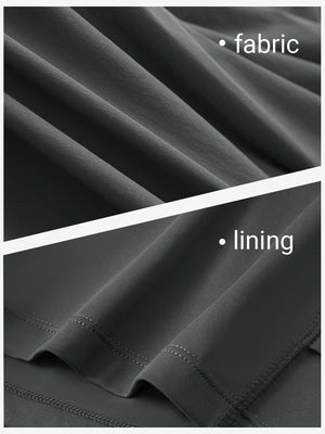 Close-up texture of dark grey women's moisture-wicking athletic tennis skirts fabric showing detailed outer and inner lining material.