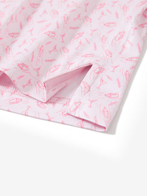 Close-up of the hem vent on the pink wine glass 4 way stretch print collared polo shirt, showing the side split for movement