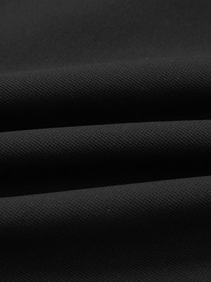 Fabric close-up of lightweight moisture wicking dress pants, showing texture and finish in black.