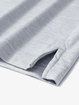 Faded Denim Heather Skin-friendly Long Sleeve Melange Polo – close-up detail of side hem slit