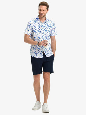 Full-body front view holding a takeaway drink cup, wearing DREAMY STARRY SKY Stylish Printing Summer Shirt.