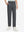 Front lower body shot of model wearing the dark grey youth water resistant cotton blend golf pants, showcasing a relaxed fit