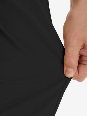 Action shot demonstrating the stretch of the black youth water resistant cotton blend golf pants for active movement