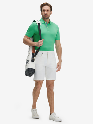 Full-body shot of a model wearing the irland green everyday classic solid polo, showing the complete casual look
