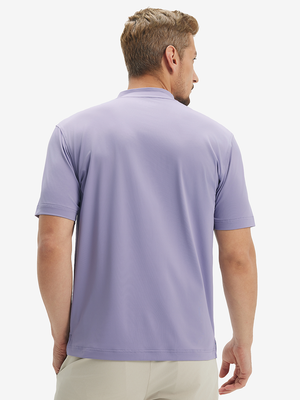 Side-back half-body view of model in lavender moisture-wicking short sleeve henley shirt
