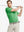 Model in GREEN STRIPE Golf Polo holding club — dynamic front half-body pose